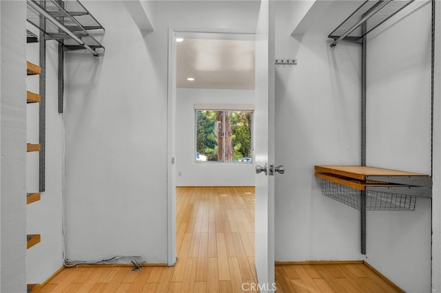 walk in closet featuring light wood-type flooring