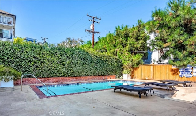 view of swimming pool featuring a patio