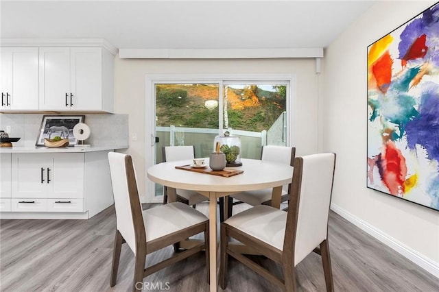 dining area with light hardwood / wood-style flooring