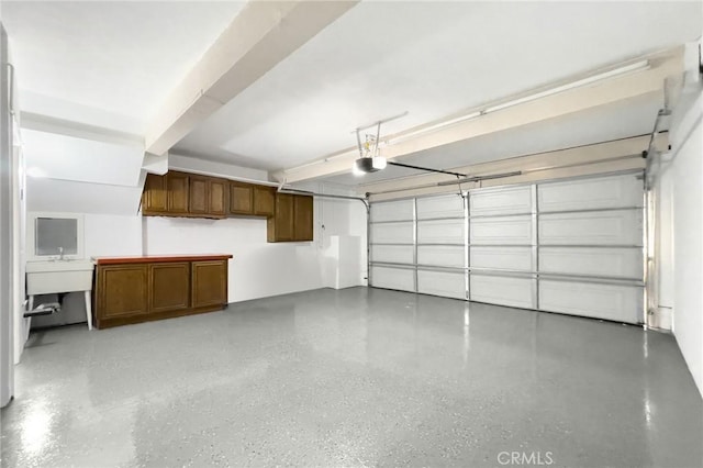 garage featuring a garage door opener and sink