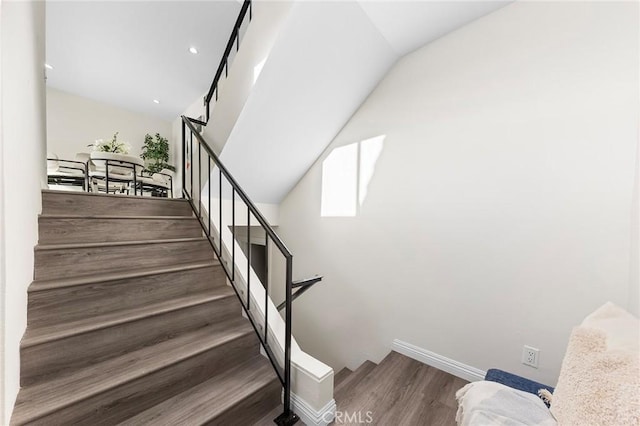 stairway featuring wood-type flooring