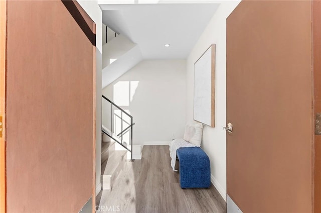 hallway with light hardwood / wood-style flooring