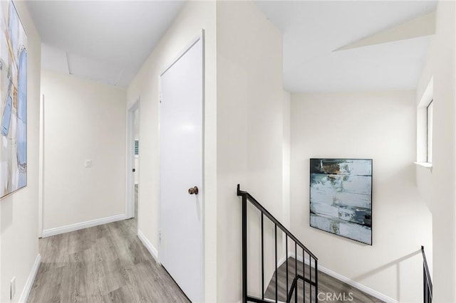 hall with light hardwood / wood-style floors