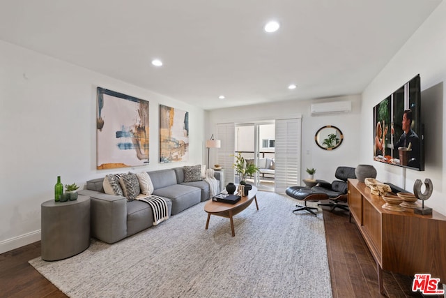 living room with a wall mounted air conditioner and dark hardwood / wood-style floors