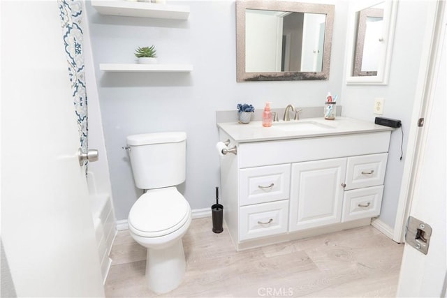 bathroom featuring toilet and vanity