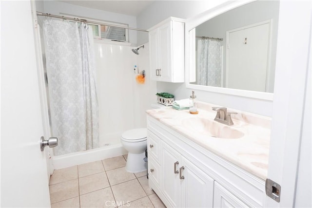 bathroom with toilet, a shower with curtain, tile patterned floors, and vanity