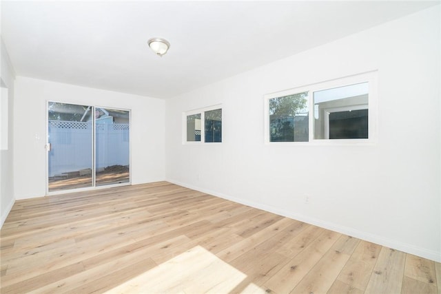 unfurnished room with light hardwood / wood-style floors