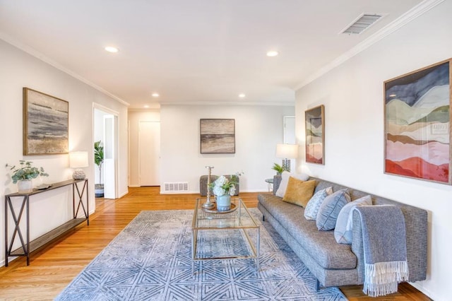 living room featuring ornamental molding and hardwood / wood-style flooring