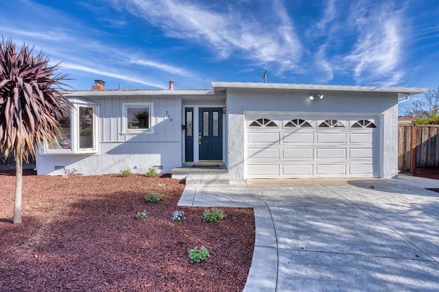 ranch-style house featuring a garage