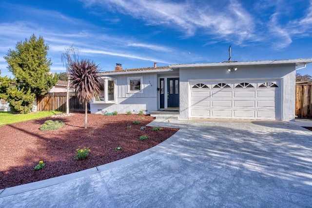 ranch-style house featuring a garage