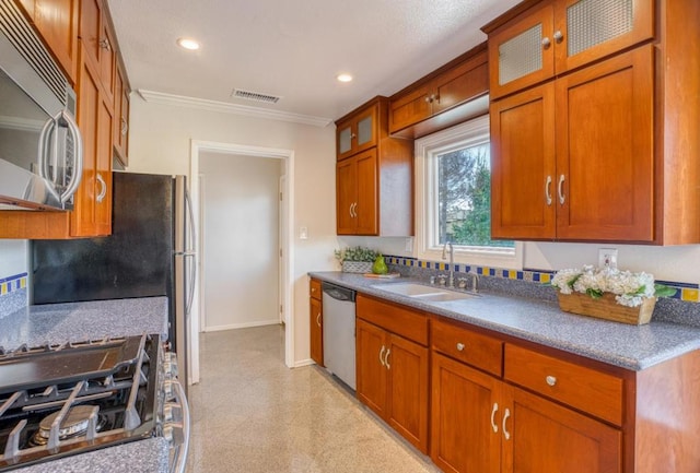 kitchen with decorative backsplash, sink, stainless steel appliances, and ornamental molding