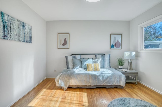 bedroom with hardwood / wood-style flooring