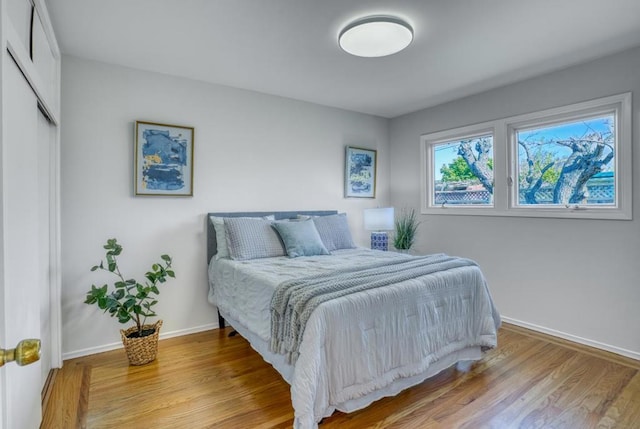 bedroom with light hardwood / wood-style floors