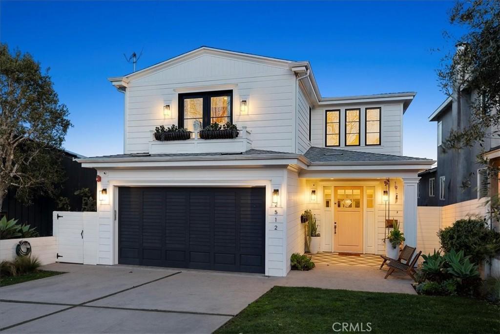 view of front of house featuring a balcony and a garage