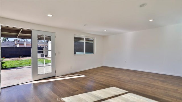 empty room featuring wood-type flooring