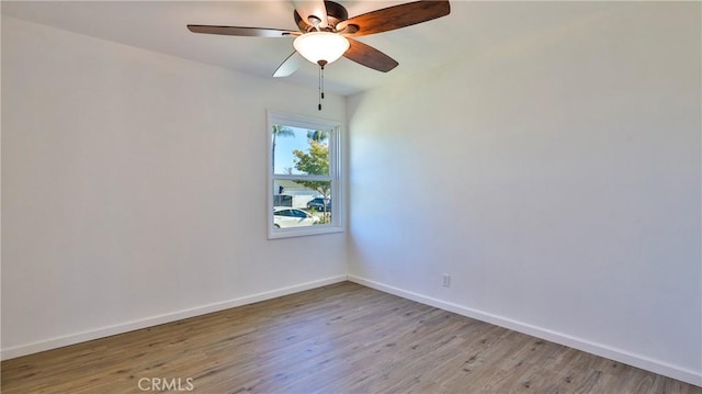 spare room with ceiling fan and light hardwood / wood-style flooring