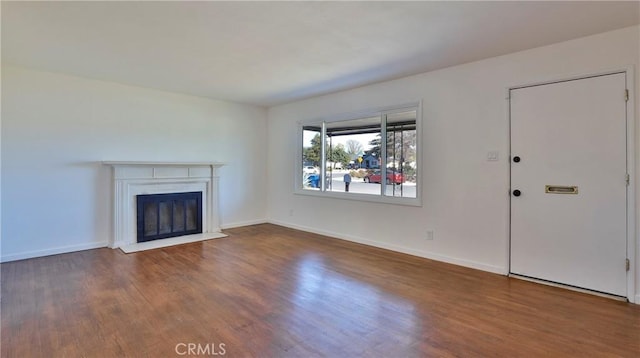 unfurnished living room featuring hardwood / wood-style floors