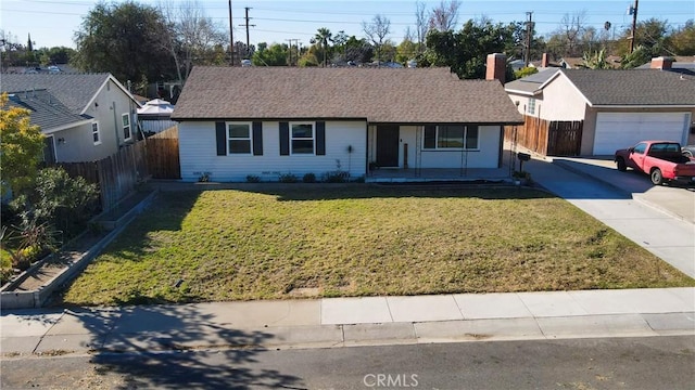 single story home featuring a front yard and a garage