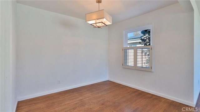 spare room featuring hardwood / wood-style floors