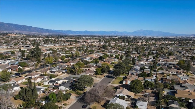 birds eye view of property with a mountain view