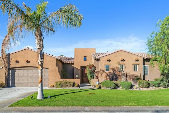 view of front of house with a front lawn and a garage