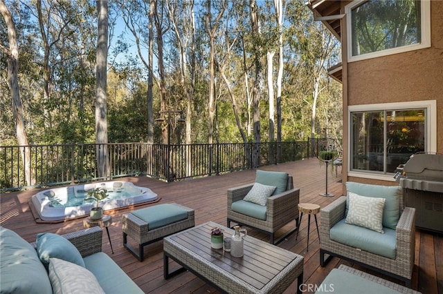 wooden terrace featuring a grill and outdoor lounge area