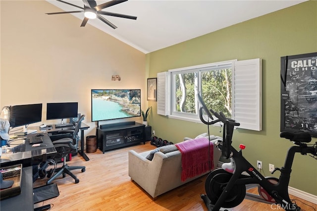 office area featuring ceiling fan, vaulted ceiling, and light hardwood / wood-style floors