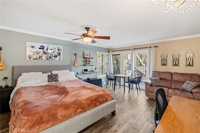 bedroom with ceiling fan with notable chandelier, hardwood / wood-style floors, and crown molding