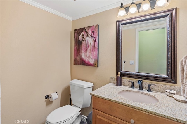 bathroom featuring ornamental molding, vanity, and toilet