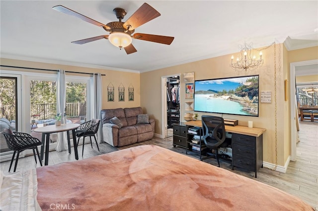 office featuring ceiling fan with notable chandelier, hardwood / wood-style floors, and ornamental molding