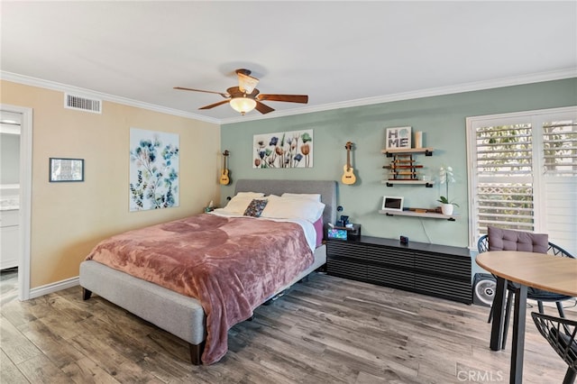 bedroom featuring wood-type flooring, ceiling fan, and crown molding