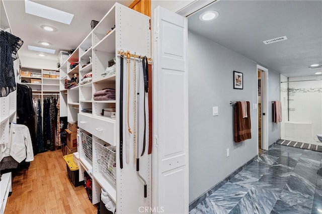 walk in closet featuring wood-type flooring