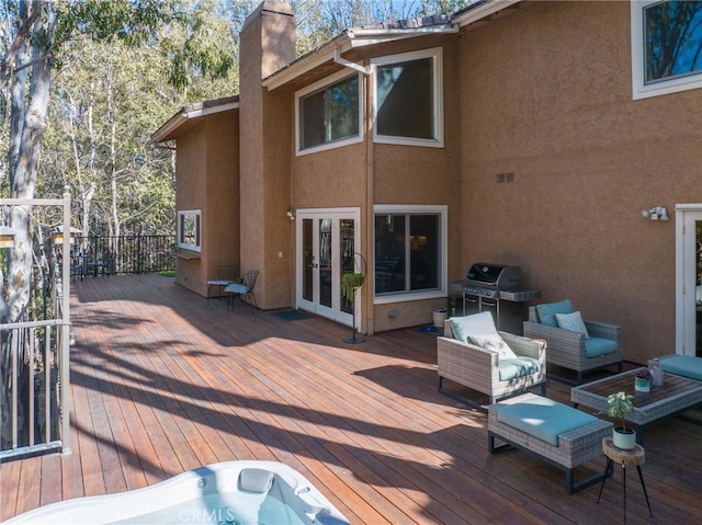 wooden terrace featuring french doors, area for grilling, and outdoor lounge area