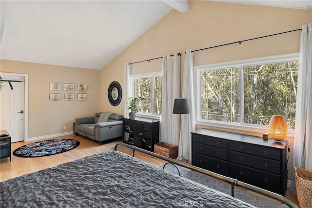 sitting room featuring hardwood / wood-style floors and vaulted ceiling with beams