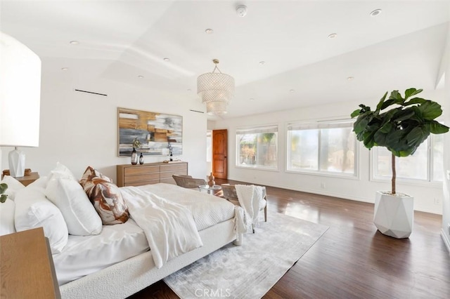 bedroom featuring vaulted ceiling and dark hardwood / wood-style floors