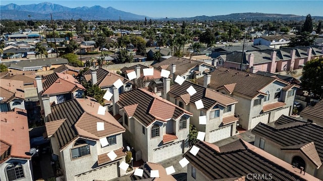 drone / aerial view featuring a mountain view