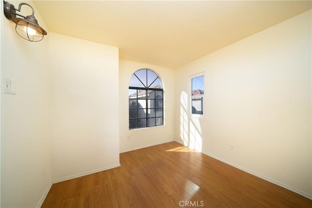 empty room featuring hardwood / wood-style flooring