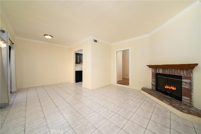 unfurnished living room with light tile patterned flooring, a brick fireplace, and crown molding