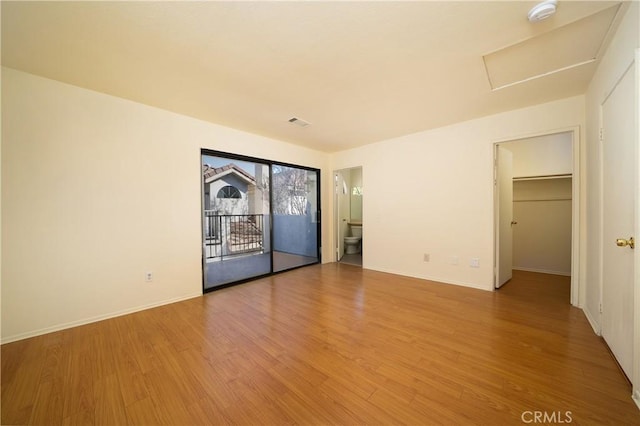 empty room featuring hardwood / wood-style flooring