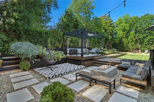 view of patio with an outdoor living space with a fire pit and a pergola