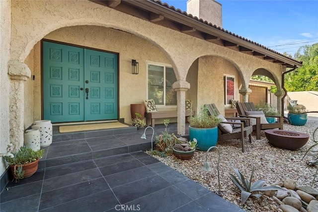 doorway to property with a patio area