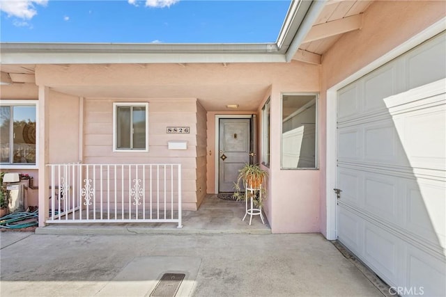 entrance to property featuring a porch