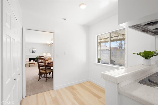 hall with light hardwood / wood-style flooring