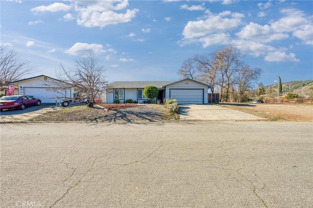 single story home featuring a garage