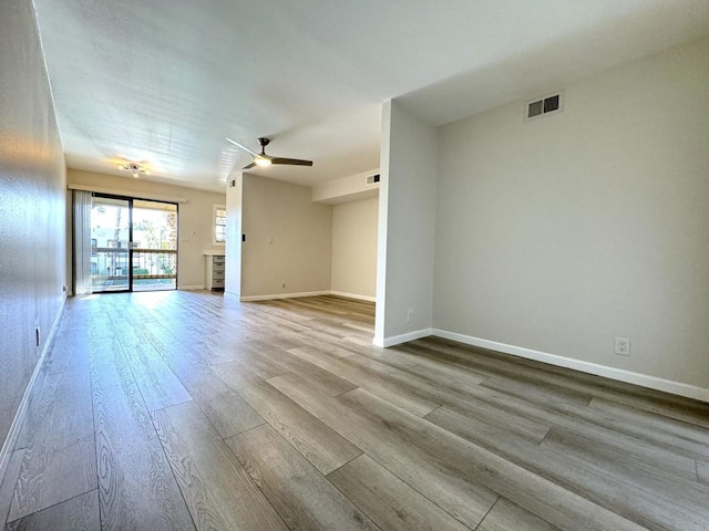 spare room with light hardwood / wood-style floors and ceiling fan