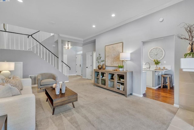 carpeted living room with crown molding