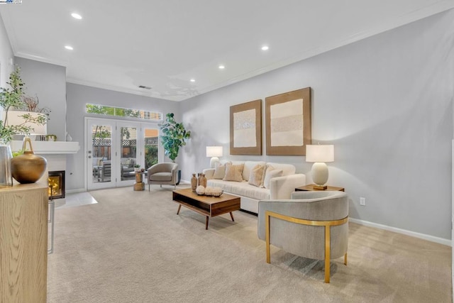 living room with light colored carpet, french doors, and ornamental molding