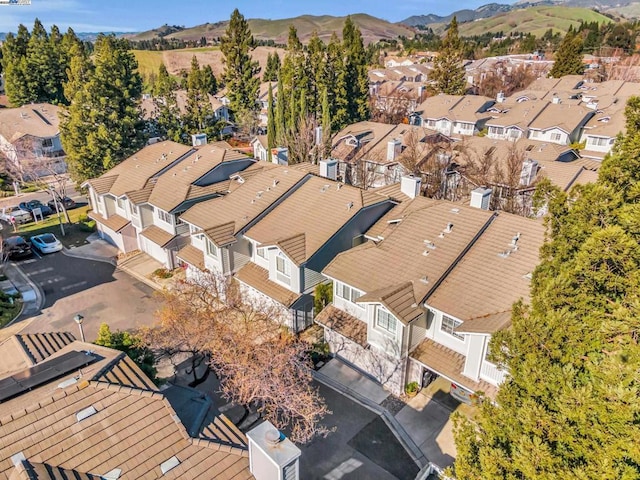 birds eye view of property with a mountain view