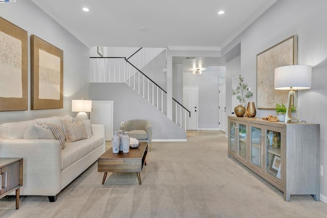 living room with ornamental molding and light colored carpet