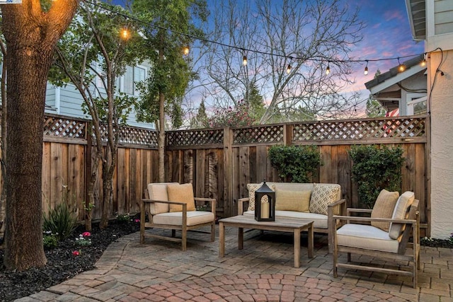 patio terrace at dusk with an outdoor hangout area